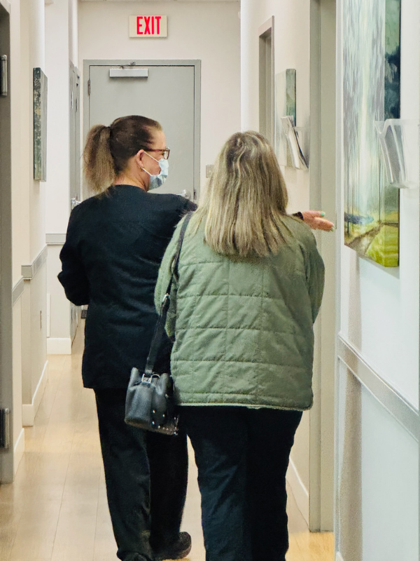 Nurse leading patient to their room for their appointment with an oral surgeon in Frederick, MD.